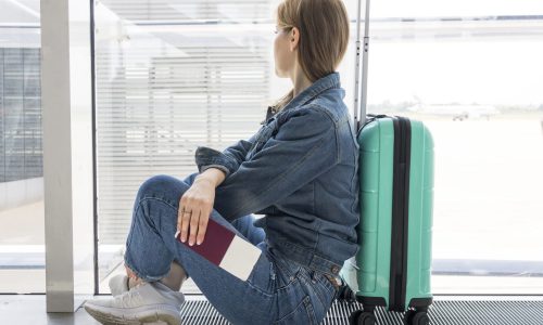 side-view-woman-waiting-airport